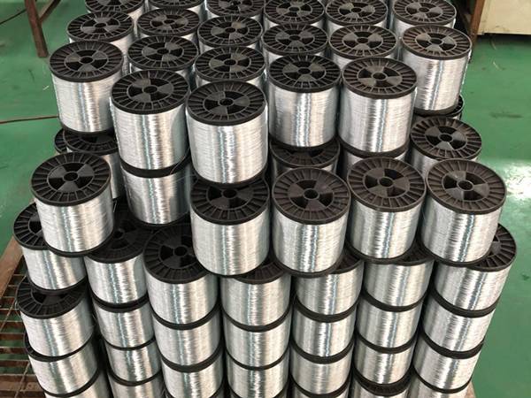 Several spools of galvanized binding wires.
