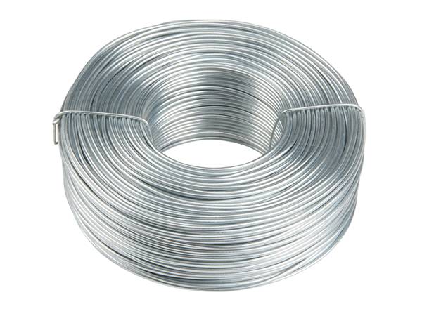 A roll of galvanized rebar tie wires on white background.