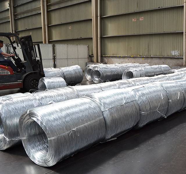 A forklift is carrying galvanized steel wires.