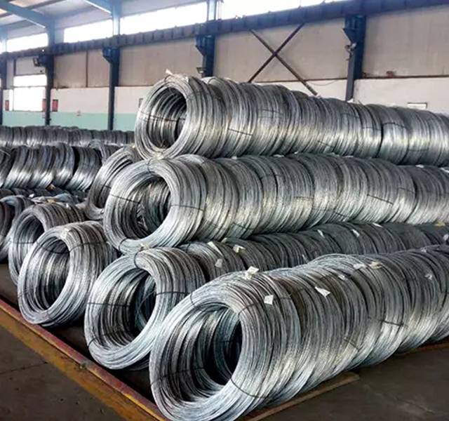 Several rolls of galvanized wires in the warehouse.