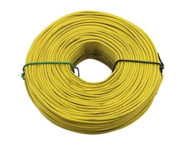 A roll of yellow PVC coated rebar tie wires on white background.