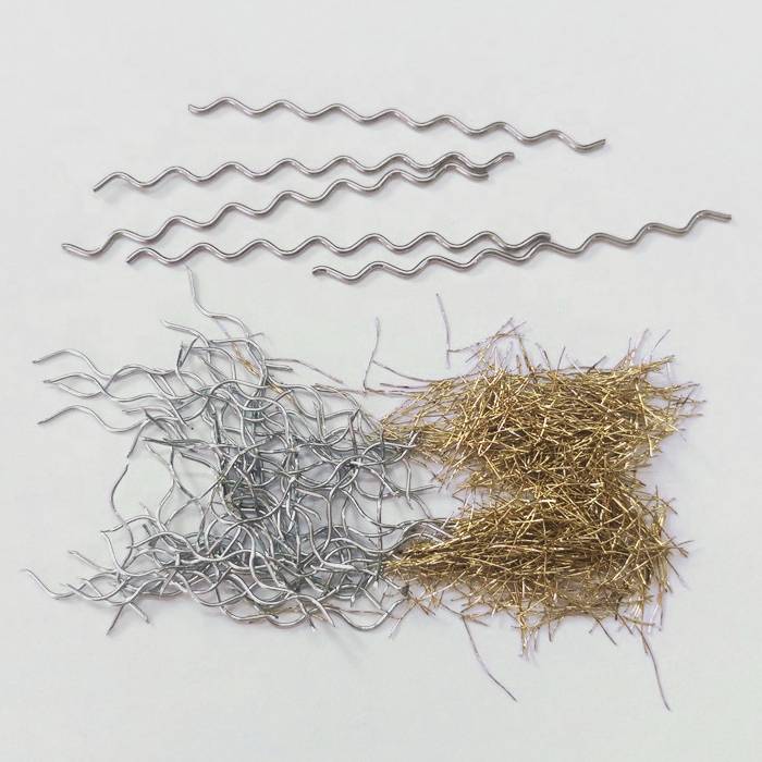 Several different types of steel fibers on gray background.